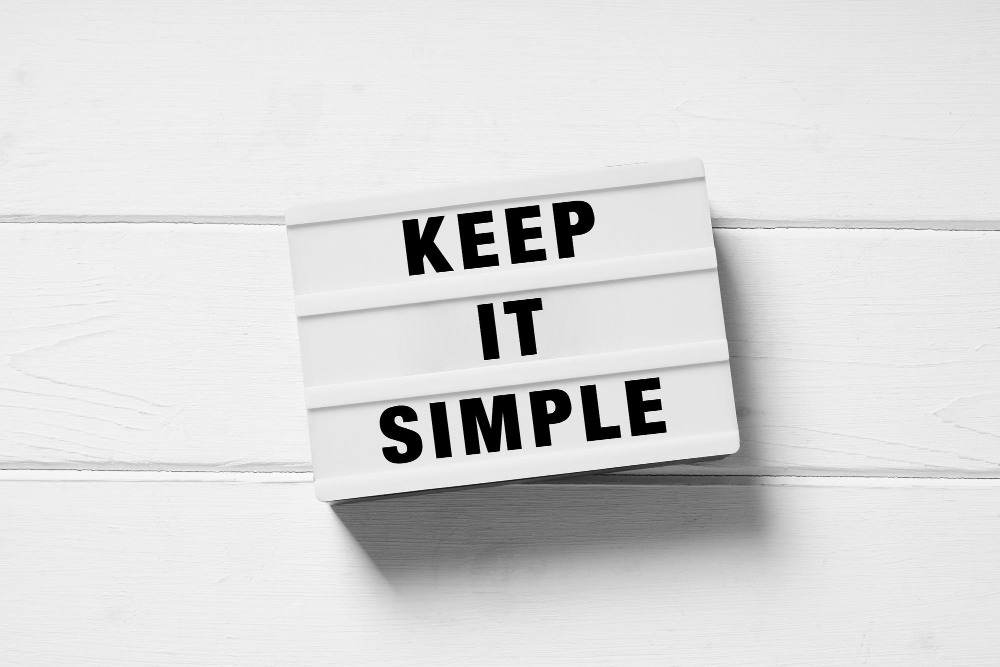 Lightbox sign "Keep it simple" on white background.